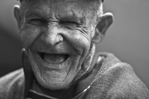 Portrait of an old man laughing 